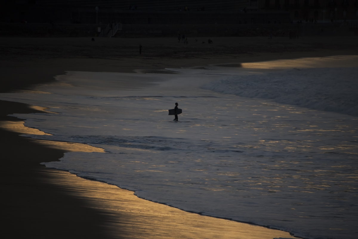 Bodyboarder at sunset.