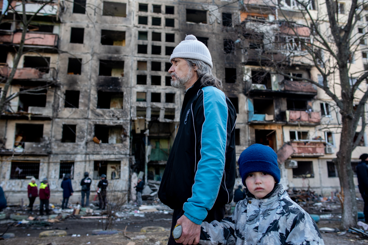 Father and Son in front of Apartment destroyed by Russian Missile