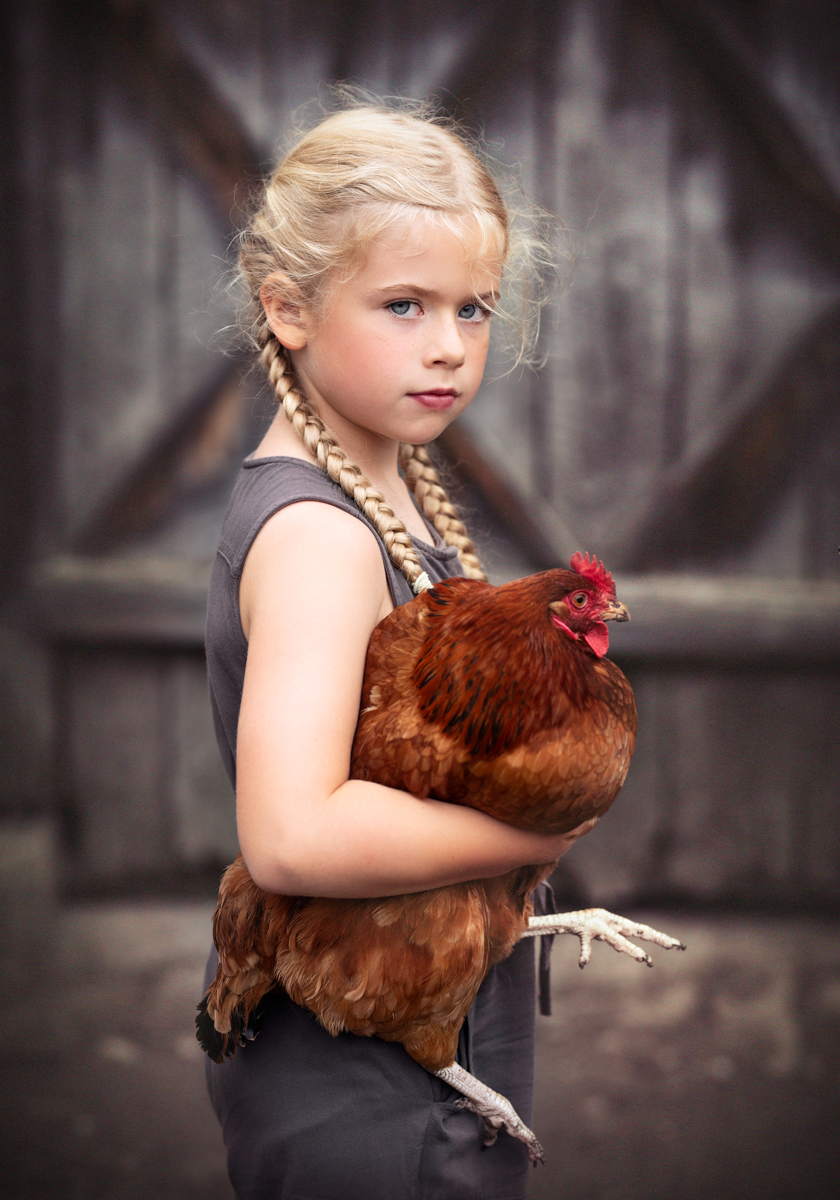 Girl with a hen.