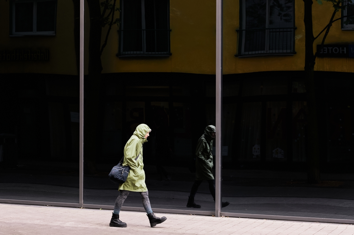 the green coat woman