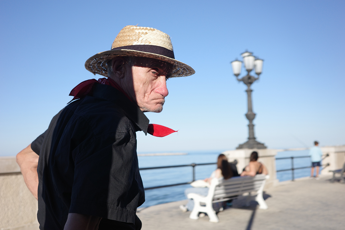 the man with the straw hat and red handkerchief