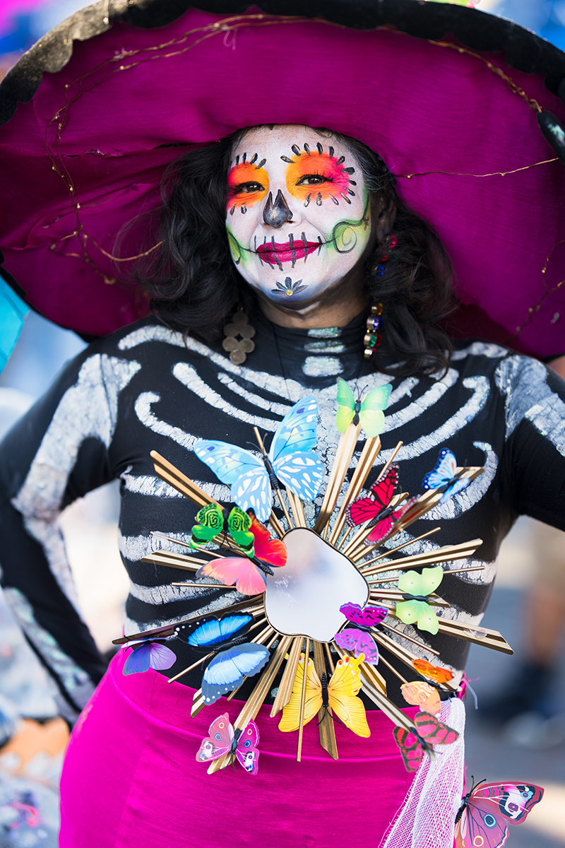 Day of the Dead - Woman in Costume with butterflies