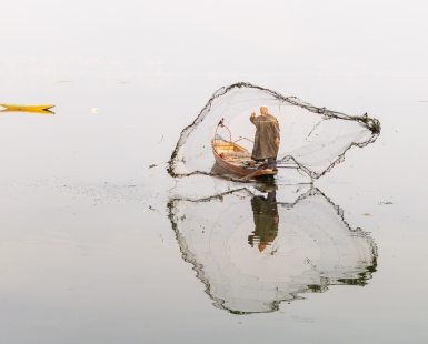 Fisherman Tossing His Net