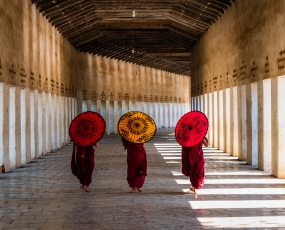 Three novices walking to a temple in Bagan